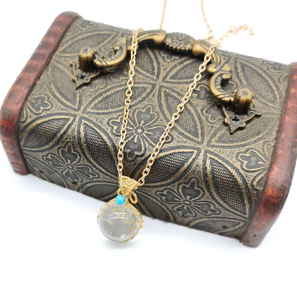 Enchanted Orb: Woven Crystal Ball Pendant on Versatile Necklace