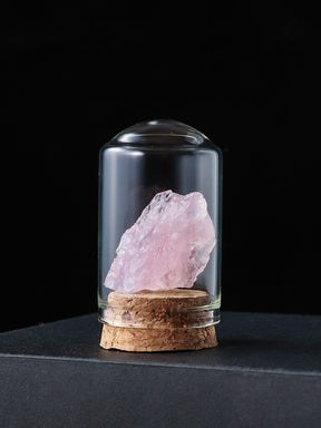 Crystal Oasis: White Crystal Specimen in Modern Glass Dome Display