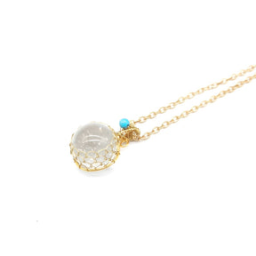 Enchanted Orb: Woven Crystal Ball Pendant on Versatile Necklace