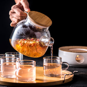 Experience the Art of Tea with Our Heat-Resistant Glass Paohua Teapot Set, Complete with 5 Tea Cups